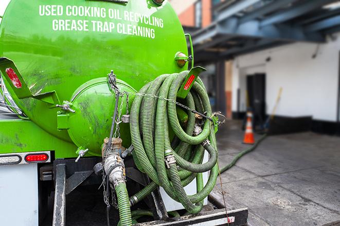 maintenance crew pumping grease trap at a fast food restaurant in Flossmoor IL